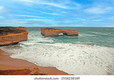 Beautiful limestone rock formation at London Arch along Great Ocean Road coastline during daytime - Powered by Shutterstock