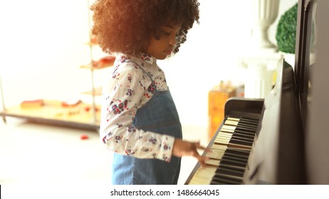 Beautiful Little African Kids Are Playing On Piano Music