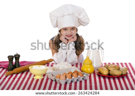 Beautiful little baby dressed as a cook, isolated on a white background