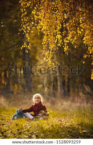 Similar – Foto Bild fröhlich lustiges Kind Mädchen isst frischen Apfel im Herbst