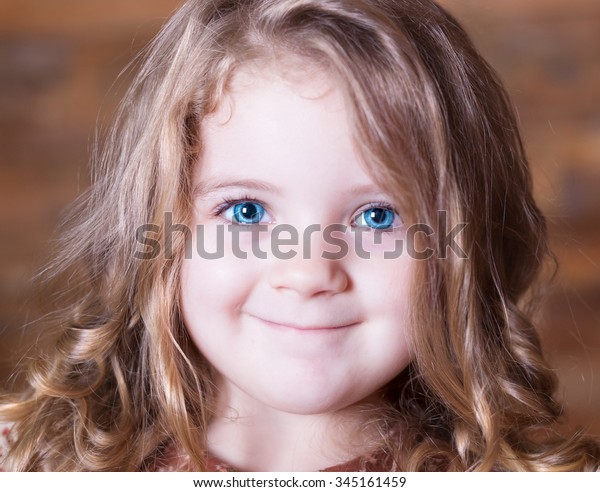 Beautiful Little Curly Blonde Girl Has Stock Photo Edit Now