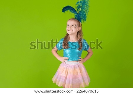 beautiful little girl dressed for carnival with hand on waist smiling looking at camera