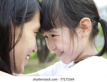 Beautiful little girl looking her mother