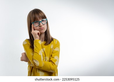 beautiful little girl looking up and thinking. she nice-looking attractive lovely sweet curious cheerful cheery smart clever girl creating new idea solution fantasize copy space isolated  - Shutterstock ID 2253095125