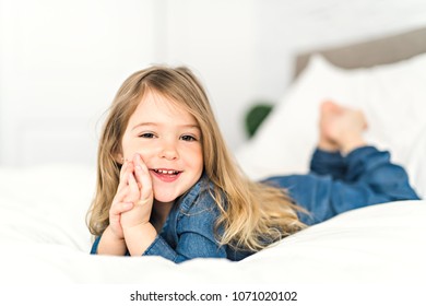 Beautiful Little Girl Lying On Bed Stock Photo 1071020102 | Shutterstock