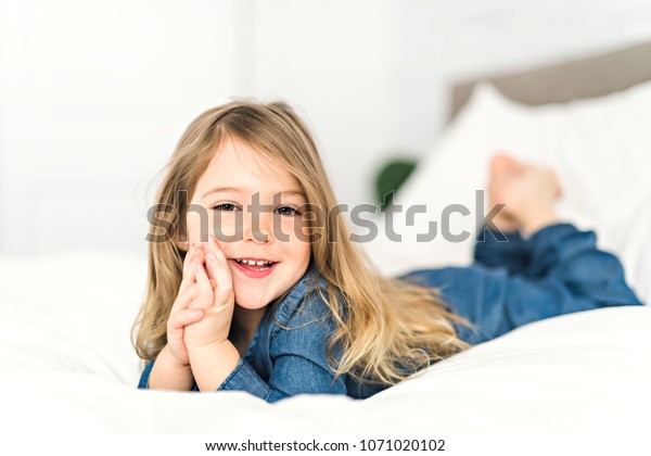 Beautiful Little Girl Lying On Bed Stock Photo 1071020102 | Shutterstock