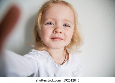 A Beautiful Little Girl Making A Selfie