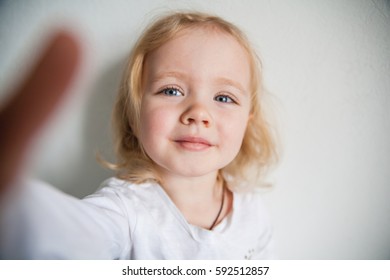 A Beautiful Little Girl Making A Selfie