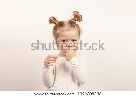 Beautiful little girl on the light background