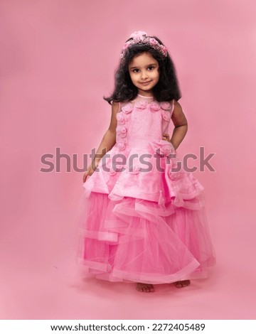 Beautiful little girl in pink warm 