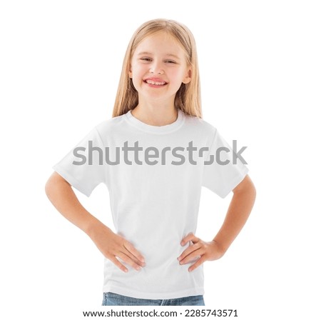 Beautiful little girl in a white blank t-shirt isolated on a white background