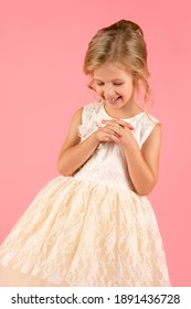 beautiful little girl in white dress cut out on pink background