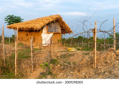 A beautiful little mud house surrounded by green trees under the blue sky at Indian Village. dreamy home scenario. - Shutterstock ID 2009298305