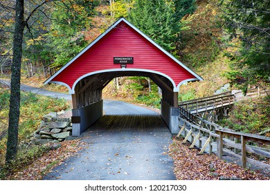 Beautiful little red covered bridge in New Hampshire during Fall season