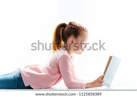 Similar – Image, Stock Photo happy school girl doing homework. Smart child working hard