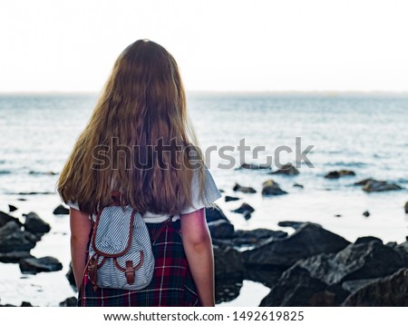 Beautiful little teen blonde girl outdoors
