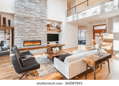 Beautiful Living Room With Hardwood Floors And Fireplace In New Luxury Home