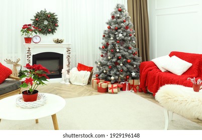 Beautiful Living Room Interior With Burning Fireplace And Christmas Tree