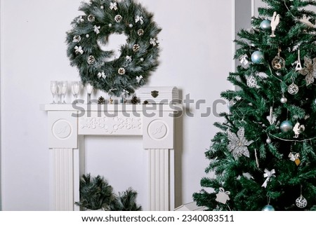 Beautiful living room interior with a fireplace. Christmas celebration. modern style interior of fireplace with christmas tree and presents in white. interior design about copy space or work space for
