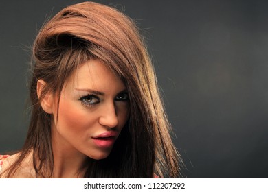 beautiful long hair brunette woman portrait, studio shot - Shutterstock ID 112207292