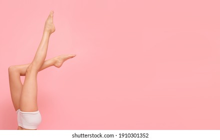 Beautiful long legs on a pink background.