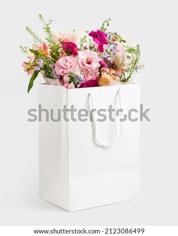 Beautiful and lovely bouquet gift box with copy space white bag.