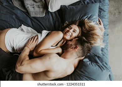  Beautiful loving couple kissing in bed