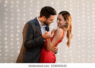 Beautiful loving happy afro couple dancing in modern restaurant. Celebrating St Valentine's Day - Powered by Shutterstock