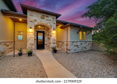 A beautiful luxury home at sunset - Shutterstock ID 2179009329
