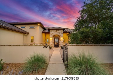 A beautiful luxury home at sunset - Shutterstock ID 2179009335