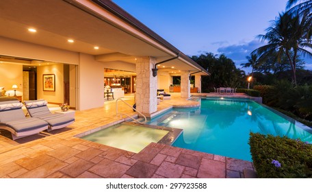 Beautiful Luxury Home with Swimming Pool at Sunset 