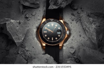 A beautiful luxury men's gold watch built into or embedded in a rock or stone. Stylish golden watch on a beautiful background of stones or rocks. Advertising photo of the watch
 - Powered by Shutterstock