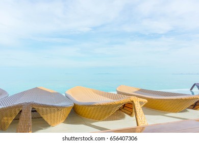 Beautiful Luxury Umbrella And Wicker Chair Around Outdoor Swimming Pool In Hotel And Resort - Boost Up Color Processing