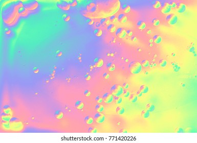 Beautiful macro close-up photography of chemical reaction, holographic liquid with rainbow bubbles and stains. - Shutterstock ID 771420226