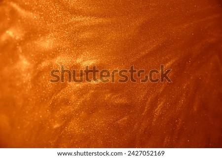 Beautiful macro shot of copper particles moving in space. Abstract glamour background.
