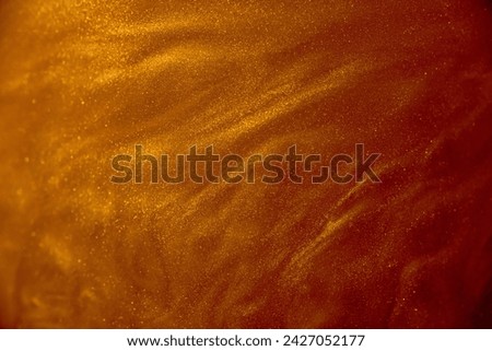 Beautiful macro shot of copper particles moving in space. Abstract glamour background.