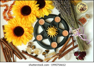 Beautiful and magical altar for Litha, Lammas or Lughnasadh Wiccan Sabbaths with sunflowers, pentagram, candles and sun symbols