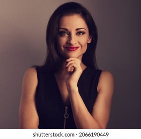 Beautiful Makeup Woman With Bright Red Lipstick Looking Happy On Toned Color Backround. Closeup Portrait