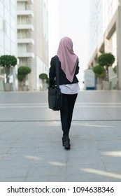 Beautiful Malay Girl Holding Mobile Phone Facing Backwards