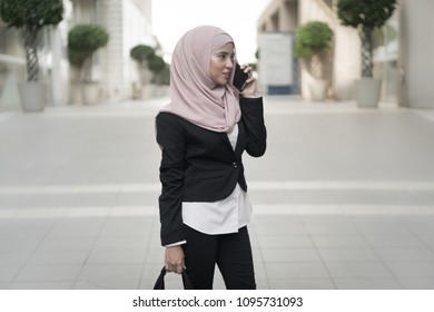 Beautiful Malay Girl Holding Mobile Phone Outdoor