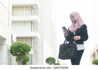 Beautiful Malay Girl Holding Mobile Phone Outdoor