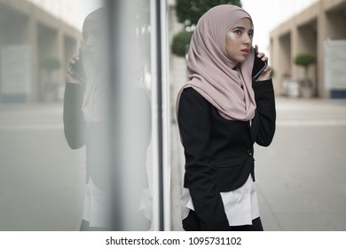 Beautiful Malay Girl Holding Mobile Phone Outdoor