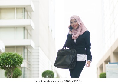 Beautiful Malay Girl Holding Mobile Phone Outdoor