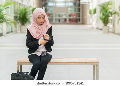 Beautiful Malay Girl Holding Mobile Phone Outdoor