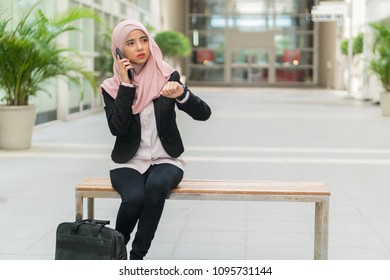 Beautiful Malay Girl Holding Mobile Phone Outdoor