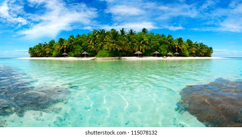 Beautiful Maldivian atoll with white beach seen from the sea.Panorama