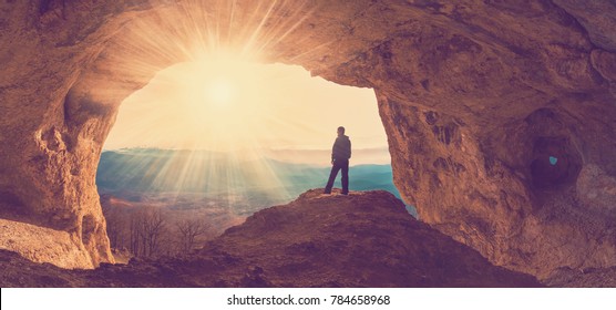 beautiful  man  mainsail  and cave mountains background - Shutterstock ID 784658968