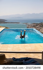 Beautiful Man Is Swiming In The Pool. Greece, Crete, Elounda.