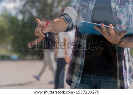 Similar – young latin man typing on his phone with emoji emoticons.