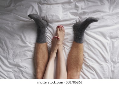 Beautiful Man Woman Couple Feet Lying In Bed Cuddling Together In Love Lifestyle Relationship Overhead